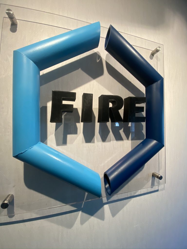 IMG_1652 Fourte International Real Estate's FIRE logo displayed on a wall